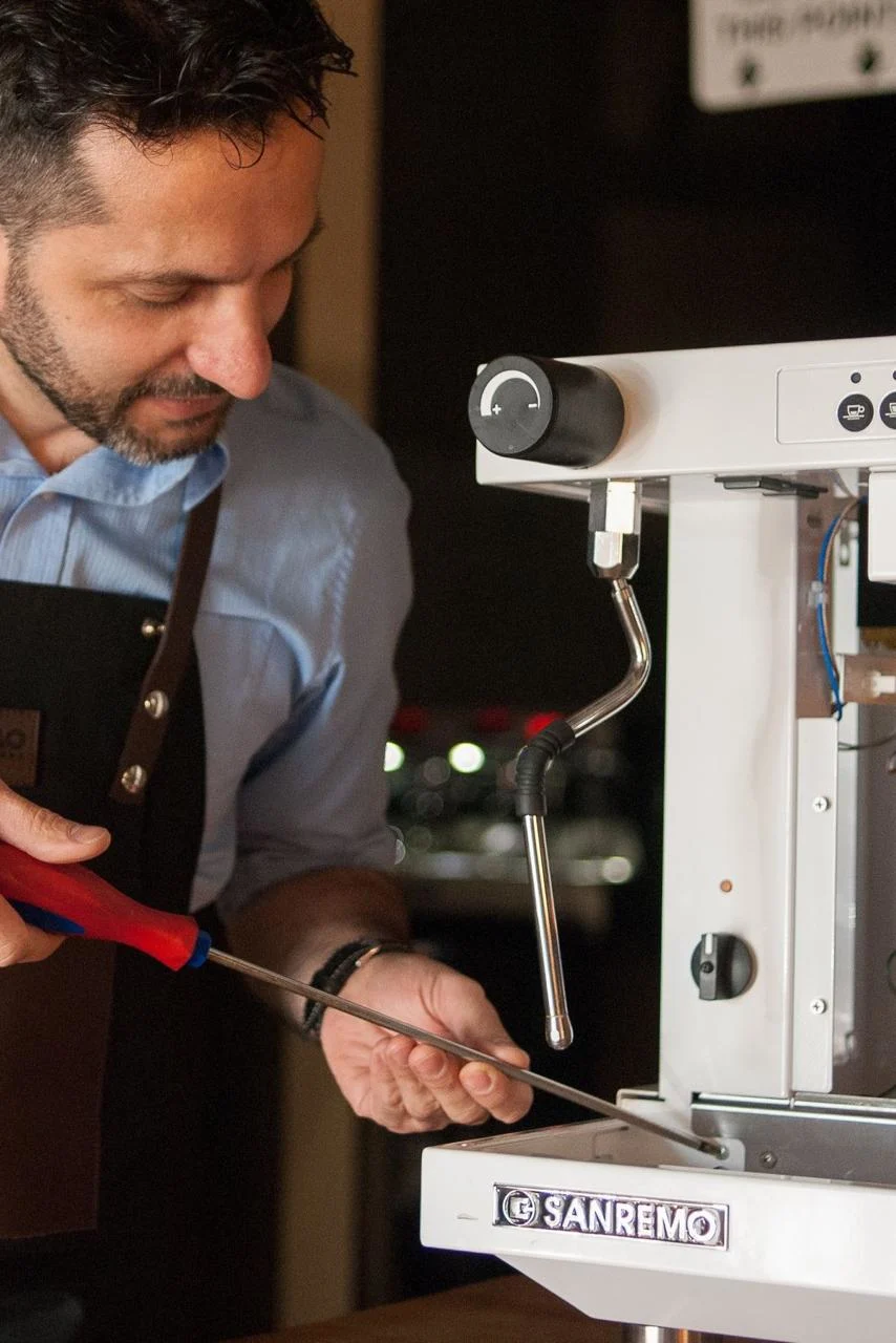 Fixxpresso technician repairing a Sanremo espresso machine